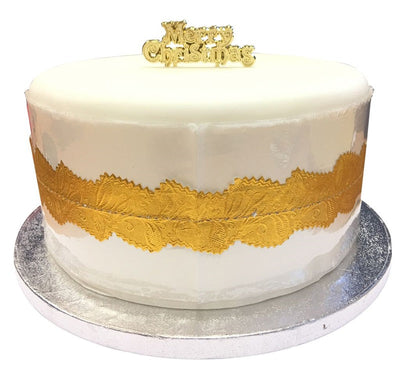 Cake frill in cream and gold on an iced cake