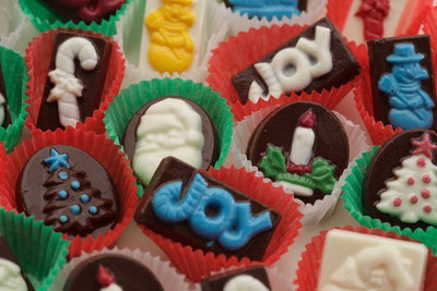 ASsorted coloured Christmas chocolates sitting in mini bon bon cups