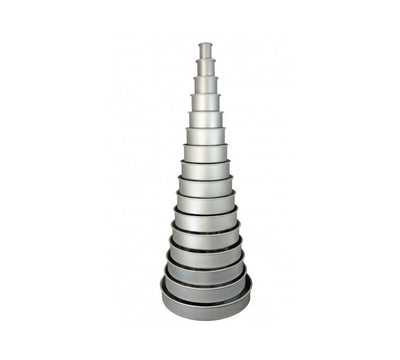 Round cake pans in a tall stack. Stacked largest to smallest in a tower formation