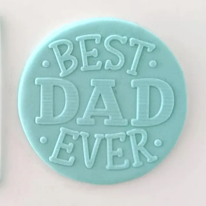 Example of fondant icing from debosser with "best dad ever""