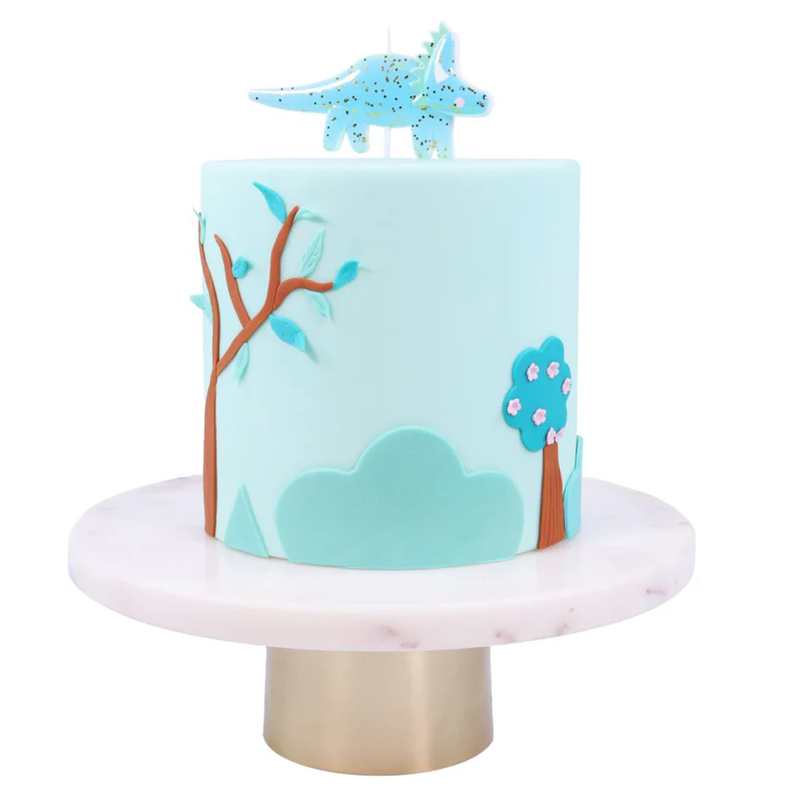 Cake with dinosaur design on a white background