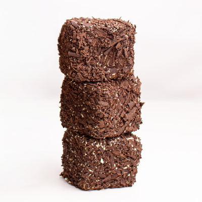 dark chocolate shavings on square cube cakes