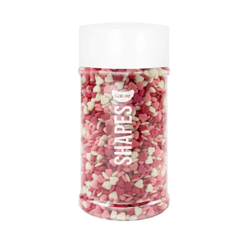 Jar of pastel pinks and white heart-shaped tiny sprinkles.