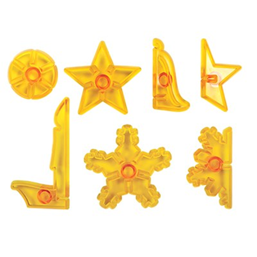 Seven translucent yellow plastic icing cutters in various shapes, including stars, a snowflake, and curved geometric forms, arranged on a plain white background.