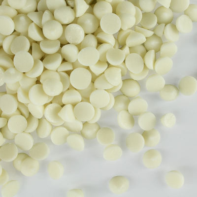 Close-up of white chocolate chips on a white background