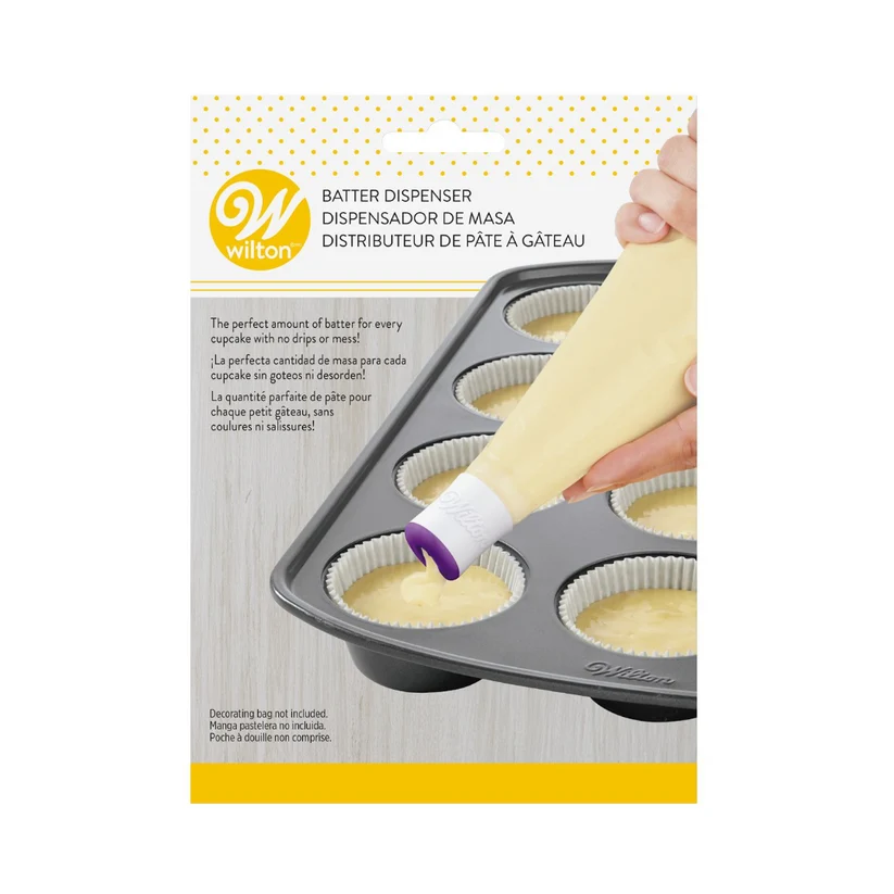 Wilton batter dispenser packaging with a hand holding the dispenser over a muffin tin.