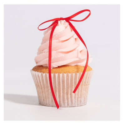 Cupcake with pink frosting and a red ribbon on a white background