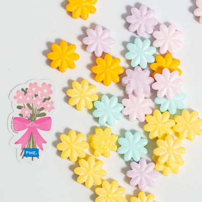 Pastel-colored flower-shaped sprinkles