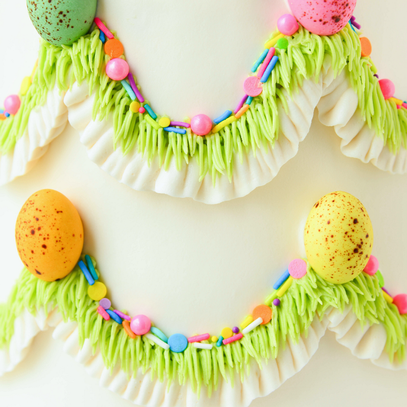 cake decorated with white buttercream icing