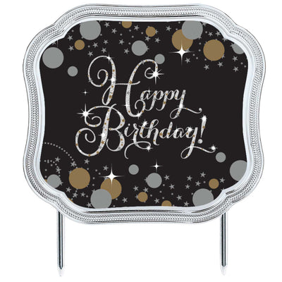 Decorative cake topper with 'Happy Birthday!' text on a black background with gold and silver confetti.