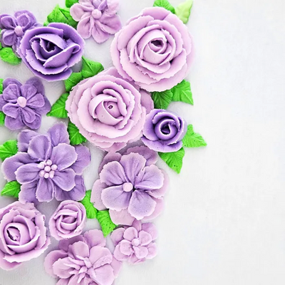 Examples of piped flowers created using the flower and leaf piping tip set