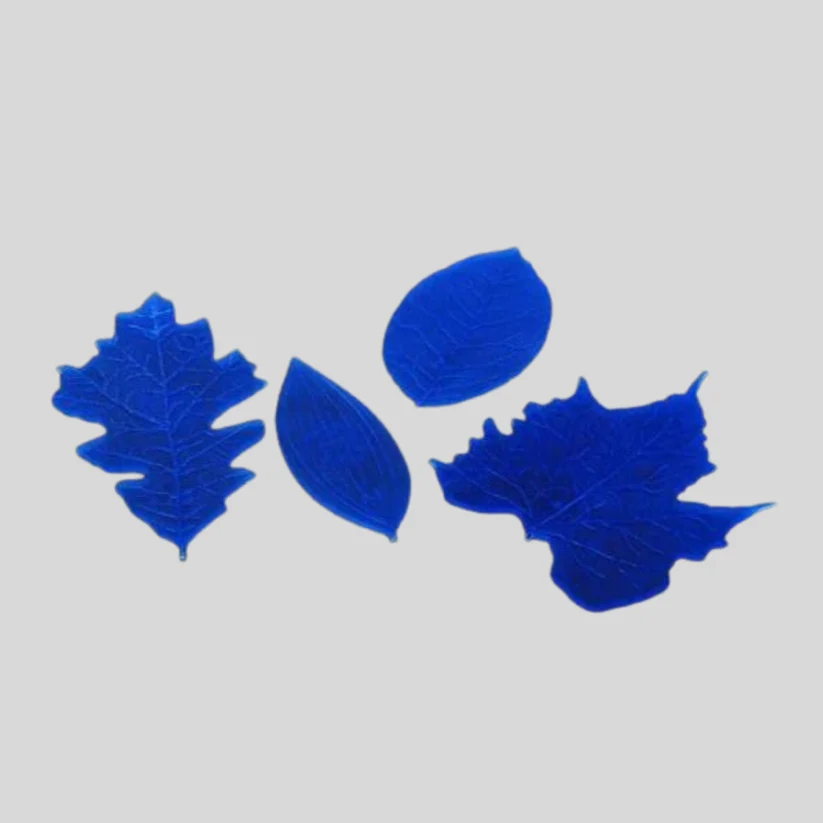 Three blue leaf-shaped veiners on a plain light gray background.