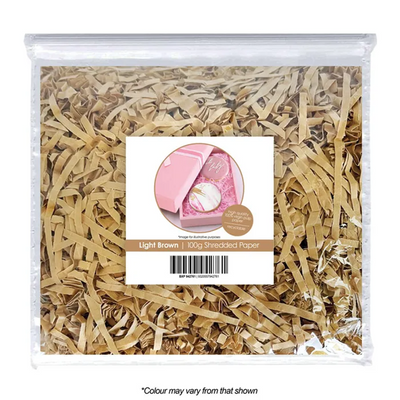 Bag of light brown shredded paper with a product image and text on a white background