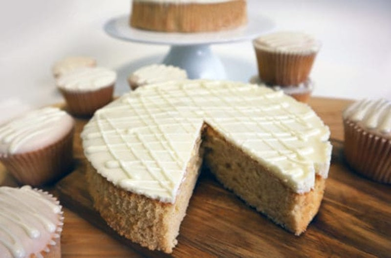 Finished example of a white mud cake iced with cream coloured frosting