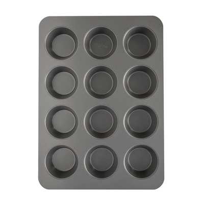 A dark gray non-stick 12-cup muffin tin with a rectangular shape and rounded corners, shown from a top-down perspective on a solid white background.