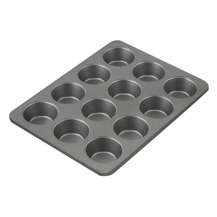 A dark gray non-stick 12-cup muffin tin shown at an angle on a plain white background.