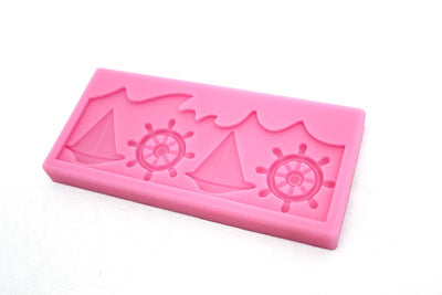 Nautical silicone mould wheel and sailboat with waves