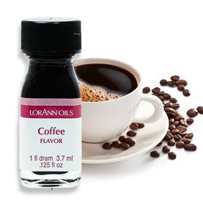 A bottle of LorAnn Oils Coffee flavoring next to a cup of coffee and scattered coffee beans.