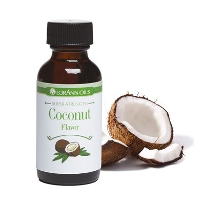 A bottle of Lorann Oils super strong coconut flavoring, with a picture of a coconut and palm leaves on the label, alongside a real coconut broken in half.