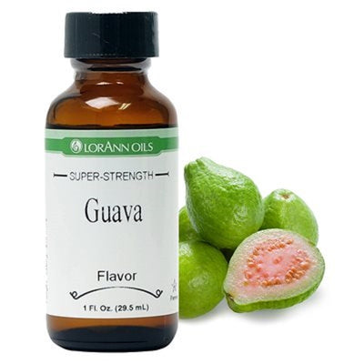 A bottle of Lorann Oils super-strength Guava flavoring, accompanied by whole and cut guava fruit.