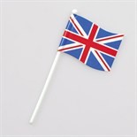 A small Union Jack flag cupcake pick, with a red, white, and blue design, on a white background.