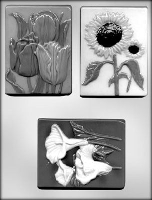 Three assorted flower plaques for chocolate moulding, featuring shapes of a sunflower, tulip, and lily.