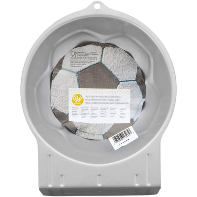 Round cake pan with a soccer ball design on a white background
