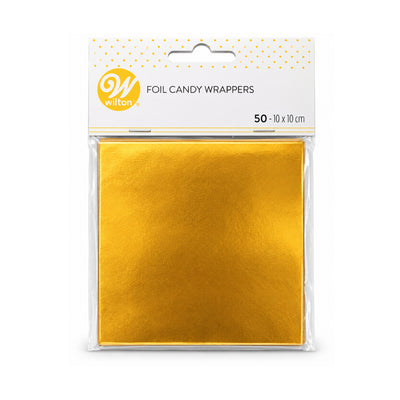 A package of Wilton brand metallic gold foil candy wrappers, containing 50 square 10 cm x 10 cm wrappers in a clear plastic bag with a white header card.
