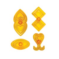 Four translucent yellow plastic icing cutters with heart and diamond shapes, arranged on a plain white background.