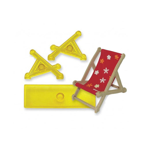 A miniature deck chair set with a red fabric seat printed with white and orange flowers, light wood frame,  three yellow plastic cutters used to make it, shown on a plain white background.