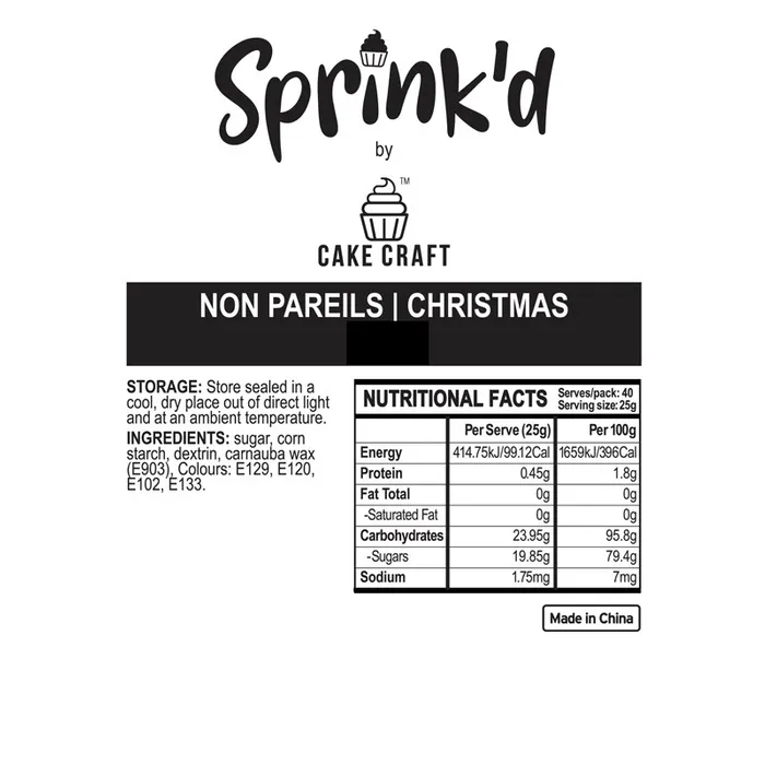 A white square label with black text and graphics for 'Sprink'd by Cake Craft Non Pareils | Christmas'. The label includes the brand name, product name, storage and ingredients information, and nutritional facts.