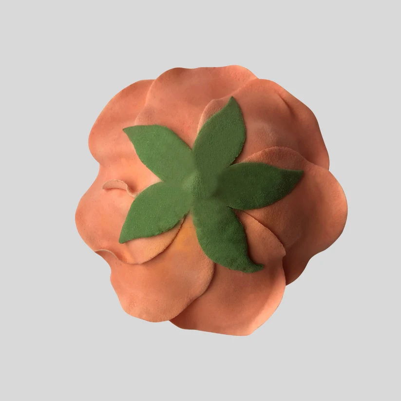 gumpaste calyx shown on the back of an icing rose