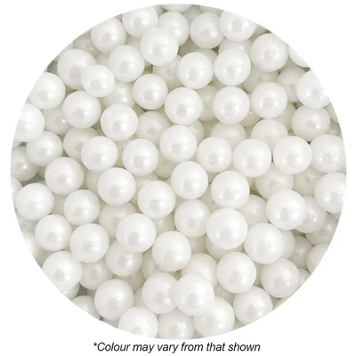 Close-up of white pearls in a circular arrangement on a white background