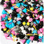Retro Sprinkle Mix. Of hot pink, electric blue, sunshine yellow, black, white and shimmering silver colours. Shapes are - stars, triangles, rods and confetti.