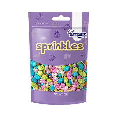 Arcoiris sprinkle mix in retail packaging. With colourful cupcake-shaped sprinkles, shimmering pearls, rods and confetti in bright pink, blue, lime green and rainbow hues.