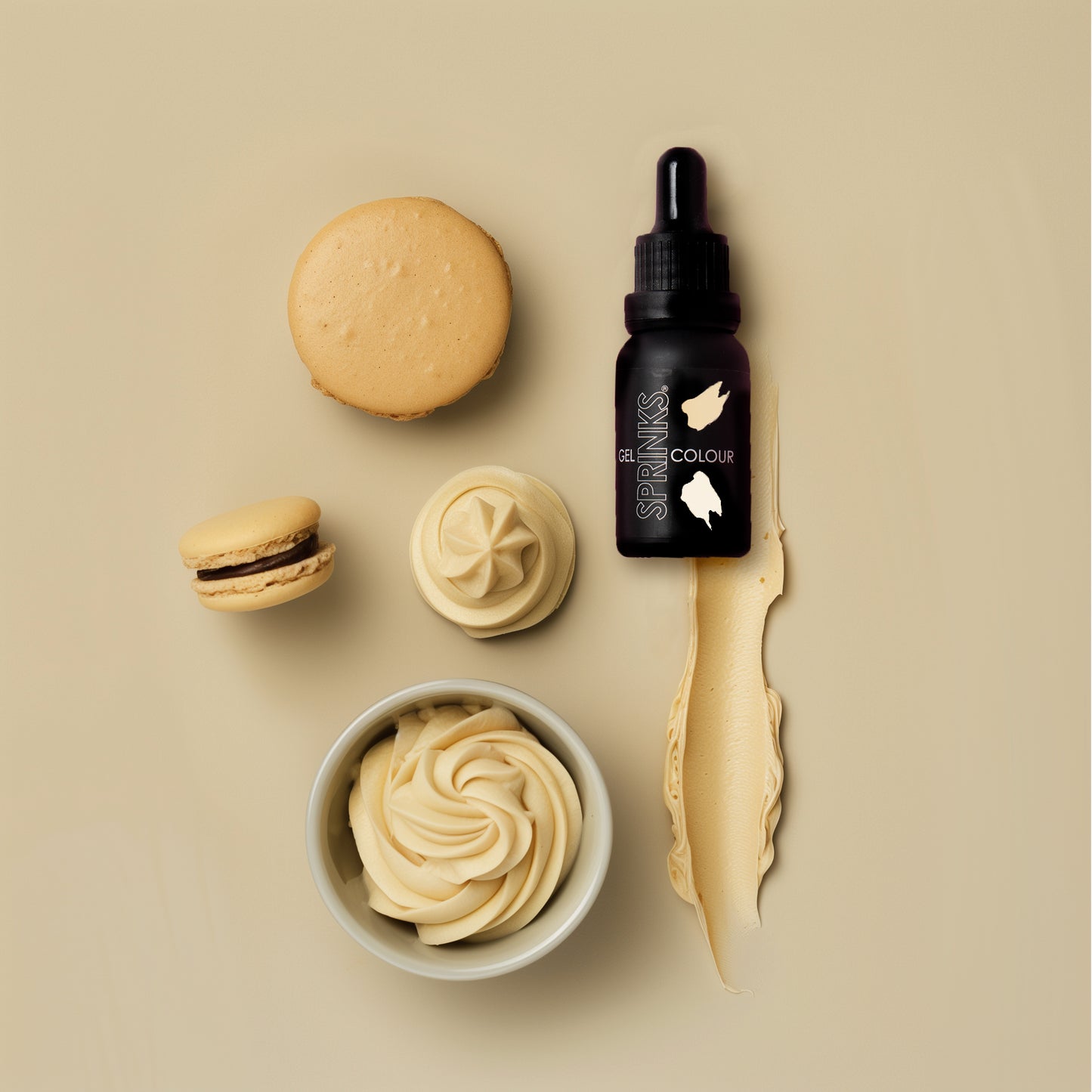 Bottle of 'Sprink' with a dropper, surrounded by macarons and cream on a beige background