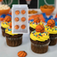 Cupcakes decorated with basketball-themed frosting and decorations.