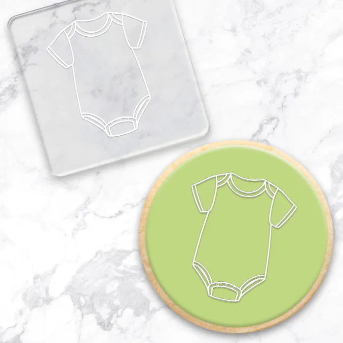 Baby onesie clear acrylic fondant debosser embosser. With example of green finished cookie as example of use