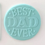 Example of fondant icing from debosser with "best dad ever""