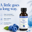 A bottle of LorAnn Oils Blue Raspberry flavor stands on a light surface with blueberries and a glass of blue liquid nearby. Large text on the left reads, 'A little goes a long way.