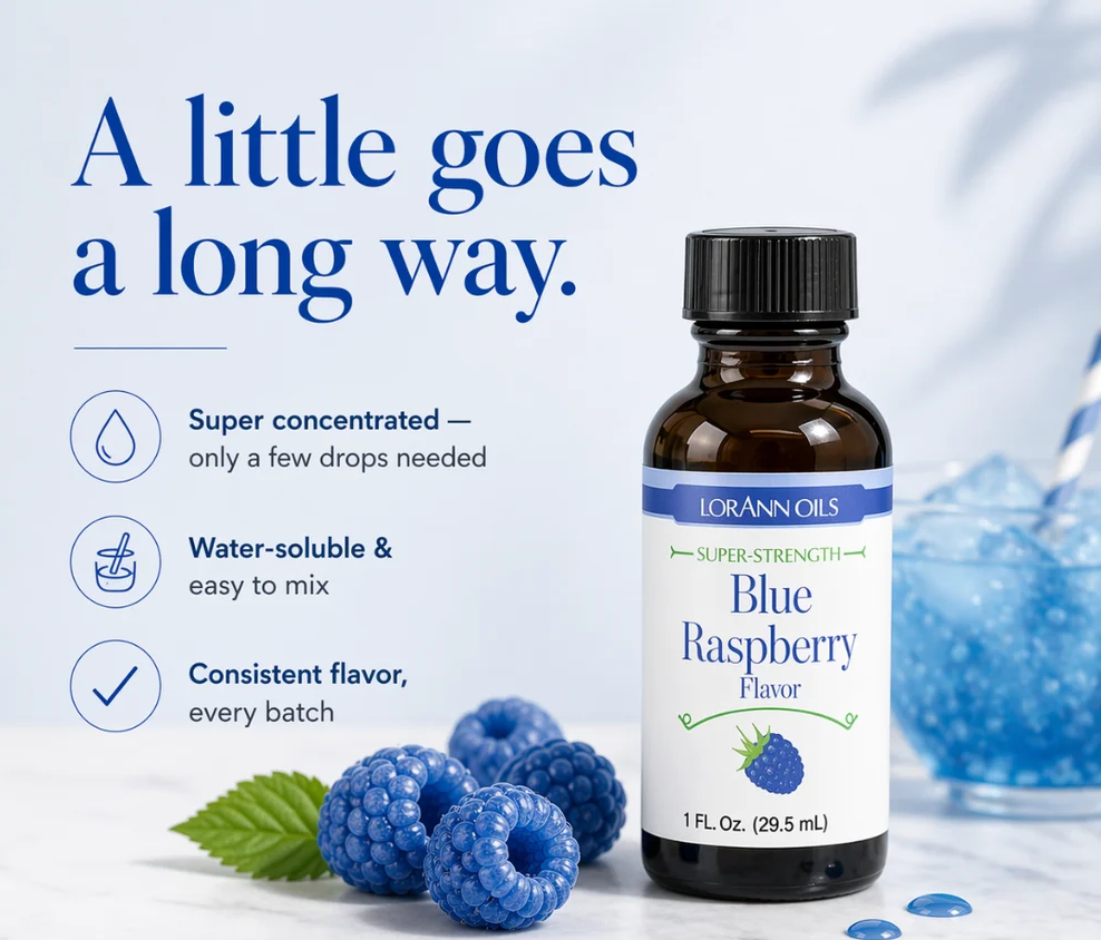 A bottle of LorAnn Oils Blue Raspberry flavor stands on a light surface with blueberries and a glass of blue liquid nearby. Large text on the left reads, 'A little goes a long way.