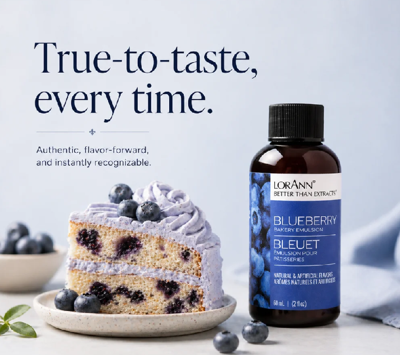 A bottle of Lorann Better Than Extract Blueberry Flavor Enhancer stands next to a blueberry pie slice on a plate, with promotional text on a light blue background.