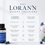 A bottle of Lorann Bakery Emulsions Blueberry Emulsion Extract displayed next to a comparison infographic explaining the differences between Lorann water-based emulsions and traditional alcohol-based extracts, with blueberries and ice cream in the background.