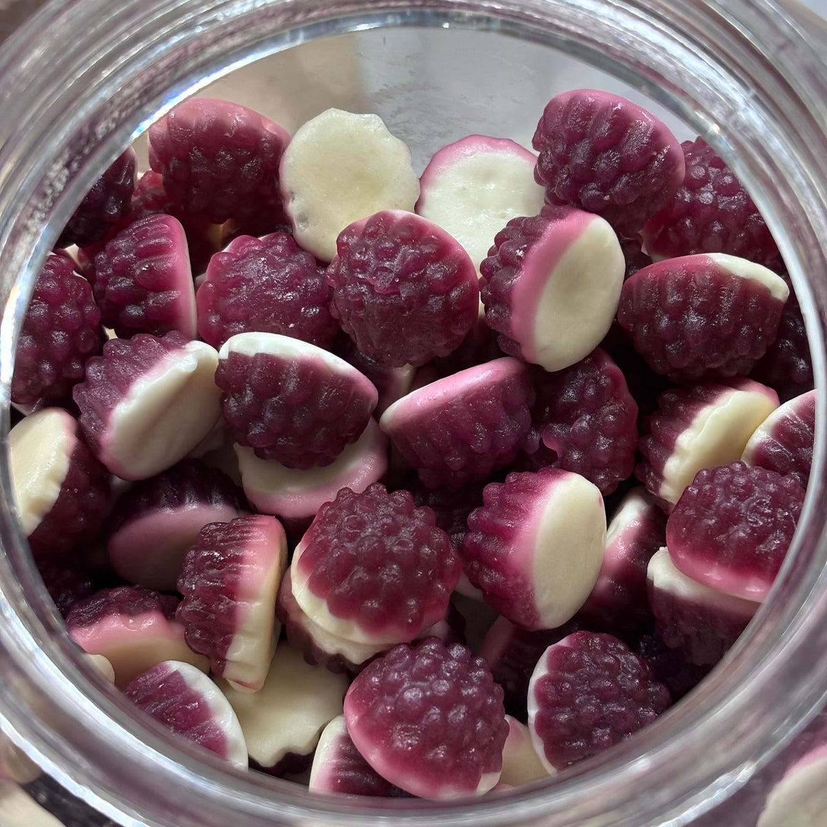 Boysenberries and cream gummy candy lollies