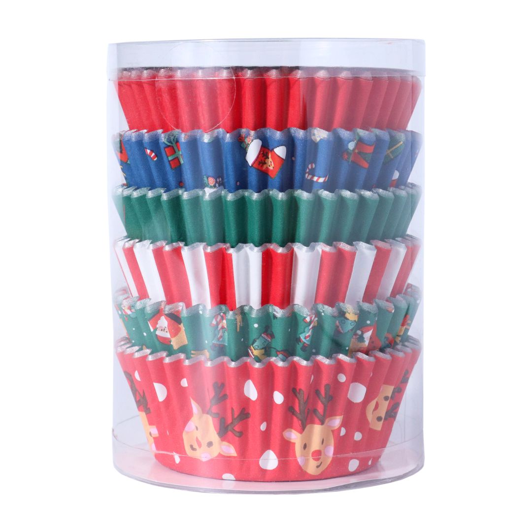 Stack of colorful cupcake liners with Christmas designs in a clear cylindrical container.