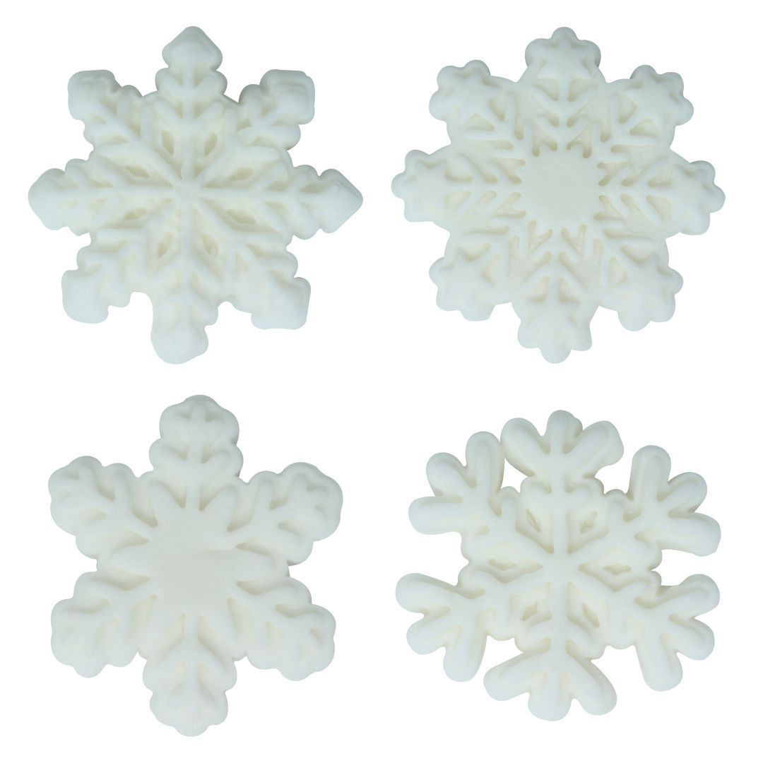 Four white snowflake-shaped icing decorations