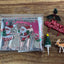Christmas cake frill silver with Santa. And plastic cake topper pieces holly, Merry Christmas plaque, Reindeer and tree