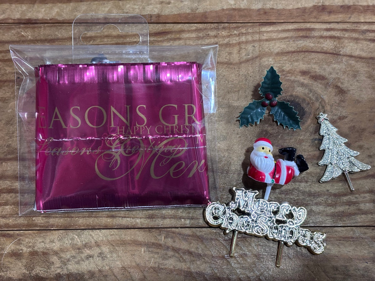 Christmas cake frill and plastic holly, with 3d santa pick, gold tree and Merry Christmas pick