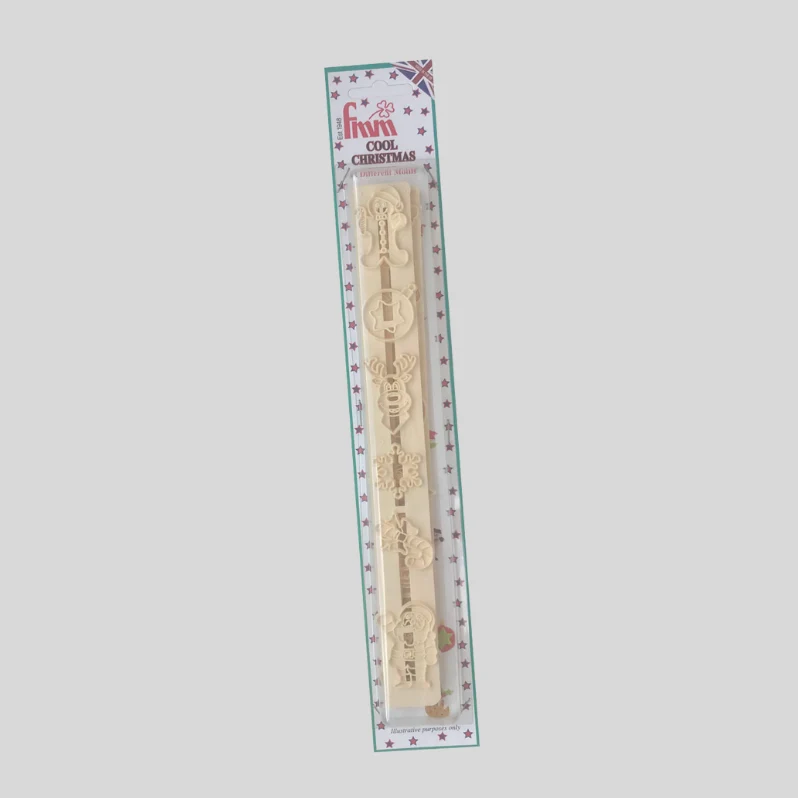 A packaged cream-colored wooden Christmas fondant cutter featuring a detailed Santa Claus design, sealed in a clear plastic sleeve with a decorative header card.