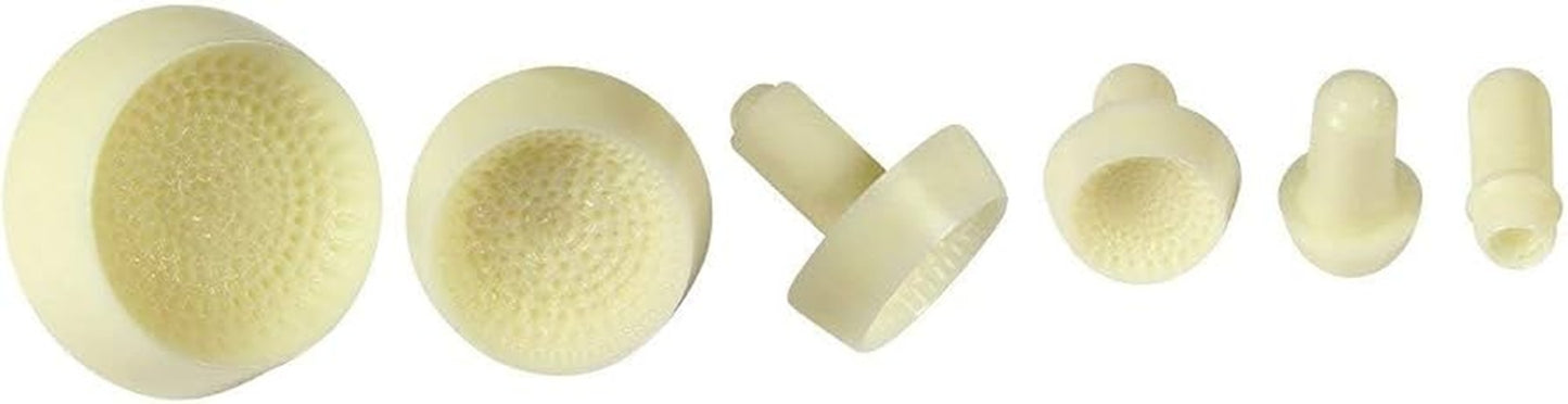 Six small off-white plastic cylindrical and round daisy cente stamps for icing with textured inner surfaces, arranged on a plain white background.